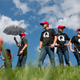 Supporters of Donald Trump wearing “QAnon” T-shirts wait in line before an October 2018 campaign rally in Tennessee. Danielle Stella, a reported supporter of the debunked far-right conspiracy theory and also a GOP candidate for Ilhan Omar’s House seat, is facing some far-out troubles of her own.